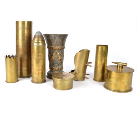 A large quantity of 'trench art', formed from artillery ordnance relics, and including: vases, tobbaco jars, ashtrays, match 