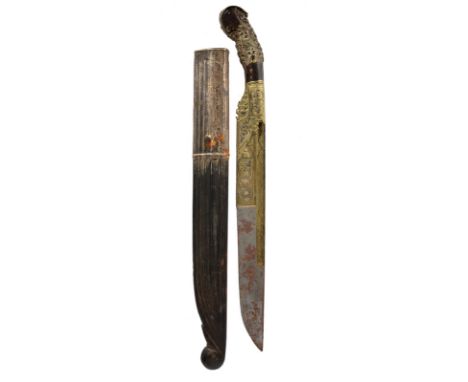 λ A Sinhalese knife (piha-kaetta), heavy single edged blade 9 in., the lower part and the fullers clad in brass with scrollin