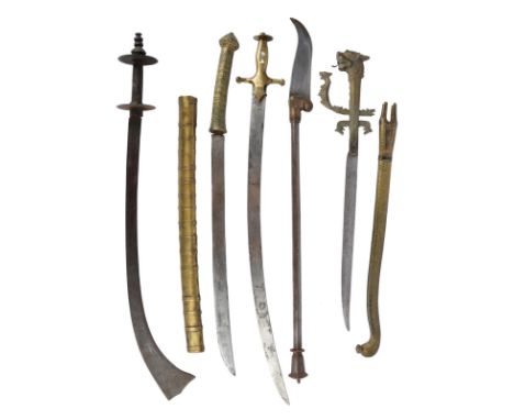 A collection of Asian weapons, comprising: a Nepalese sacrificial sword (kora), forward curving flared blade 22 in., iron hil