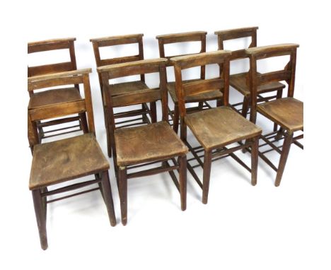Set of eight chapel chairs, elm solid saddle seats, prayer book trough, turned legs and stretchers, c 1900 (8)