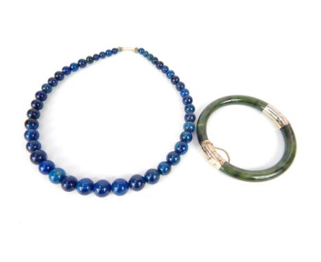 Lapis Lazuli beaded necklace with 9ct yellow gold clasp, and a Chinese green hardstone and white metal bangle 