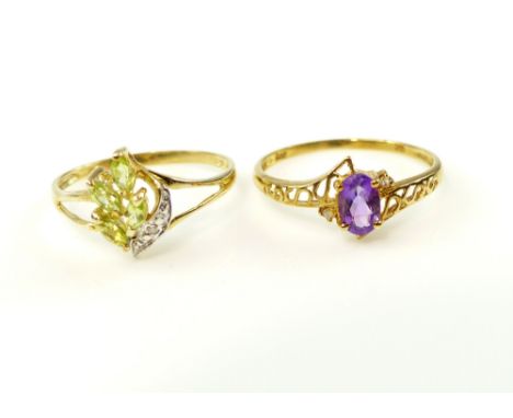 Marquise cut peridot and diamond cluster ring set within a 9ct yellow gold band and a yellow gold and amethyst ring  