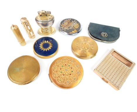 A collection of vintage yellow metal compacts, to include a Rimmel compact, the top with filigree decoration, and a Margaret 