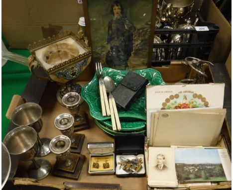 A box containing a collection of items to include a pair of folding fork and spoon, in case, various candlesticks, a box of a