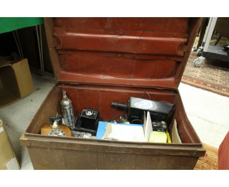 A tin trunk and two boxes of sundries to include studio pottery, carved ornamental face mask, Khmer style head, hand tools, v