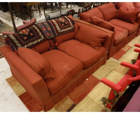 A pair of two seat sofas by Sofa Workshop in red upholstery