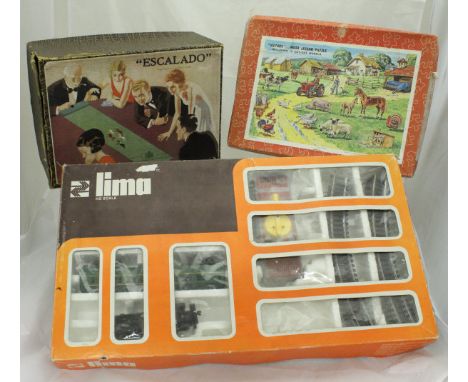 A Chad Valley "Escalado" horse racing game, boxed, Lima HO scale train set (incomplete), three various puzzles, and a Parker 