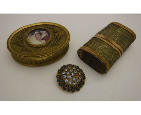 A circa 1900 French embossed gilt brass oval lidded box with later inset portrait medallion to lid opening to reveal a paste 