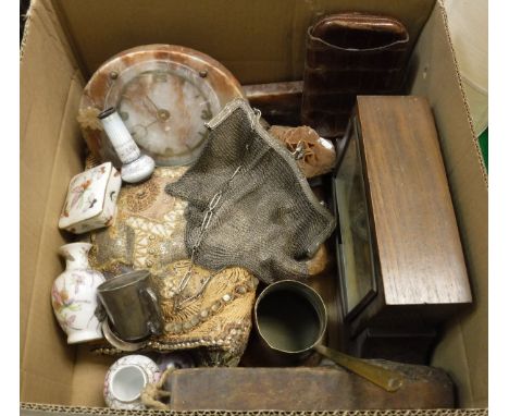 A box containing an onyx mantle clock with applied floral decoration, an oak cased mantle clock, a crocodile skin cigar case,