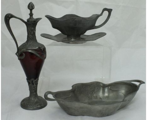 An Orivit Art Nouveau pewter sauce boat no'd "2137" to base, an Orivit shaped dish and a ruby glass pewter mounted ewer in th