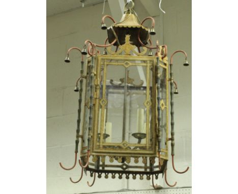 A painted metal hall lantern in the Regency style with faux bamboo column and bell decoration enclosing a four light unit