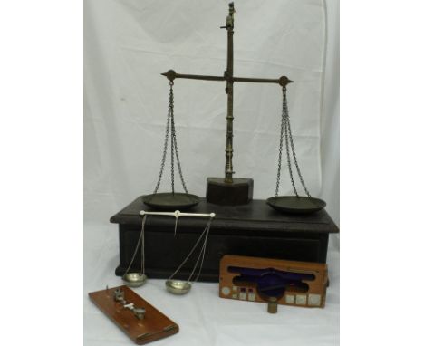 A Victorian oak and brass set of scales with drawer containing various weights, a set of cup weights etc, together with mahog