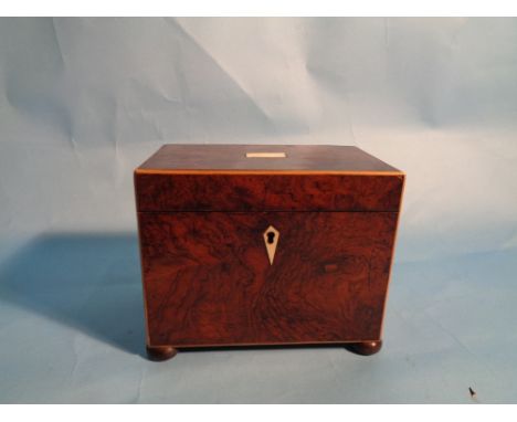 A Burr Walnut tea caddy.  