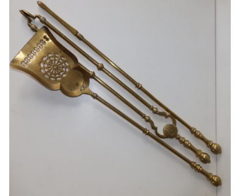 A three piece set of Victorian Golden Jubilee fire tools, 25.5".