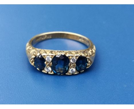 A seven stone sapphire &amp; diamond set 18ct gold ring.  Finger size N.