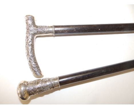 A Chinese  white metal mounted swagger stick, 26" and another, 20.5" - possibly cut down. (2)