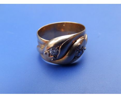An early 20thC 18ct band ring set with two small old cut diamonds - Chester 1915.  Finger size U/V.