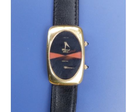 A Chopard 18ct gold dual time wrist watch, the oval black dial marked for 'Local Time' and 'Home Time', the rectangular case 
