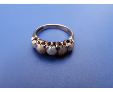 A Victorian natural pearl set 9ct gold ring.  Finger size L.