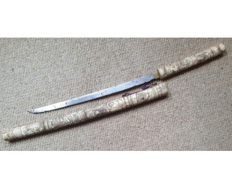 A Japanese sword with carved bone hilt &amp; scabbard, 29.5" - scabbard a/f.