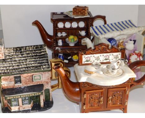 Two Cardew pottery novelty teapots, a Bovey Pottery Coronation Street teapot and a Portmeirion stove teapot. (4)