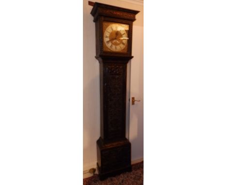 A George III eight day striking carved oak longcase clock by George Hewett of Marlborough, the square brass dial with subsidi