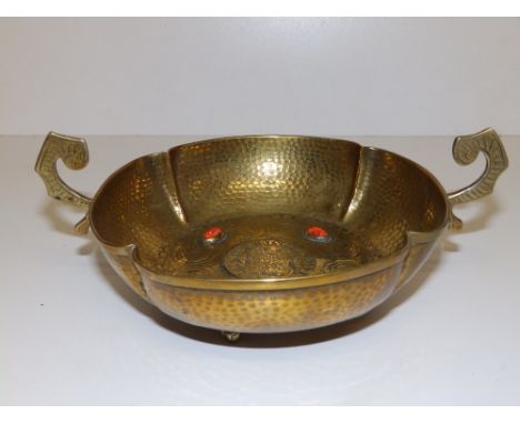A reproduction 17thC style bowl applied with red enamel cabochons, 8.75" across handles.