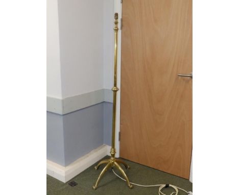 A plain telescopic brass Arts &amp; Crafts standard lamp by W.A.S. Benson , on four paw feet, 60" overall height.