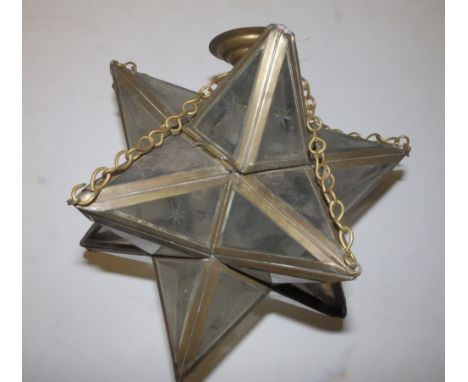 A brass framed Star of David glass panelled light shade, 11.5" across.