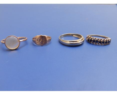 A child's 9ct gold signet ring and three other 9ct rings. (4)