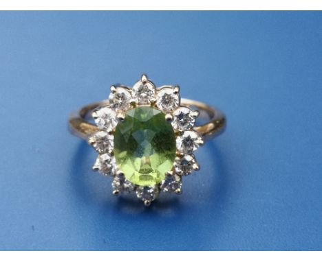 A modern peridot &amp; diamond set 14K oval cluster ring.  Finger size N.