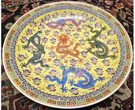 Highly decorative Chinese circular ceramic charger with varuois mythical Dragons. Approx. 33cms D
reasonable used condition w