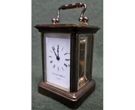 Mathhew Norman 20th century small brass and glass carriage clock. Approx. 8cms H
reasonable used with a few scratches. not te