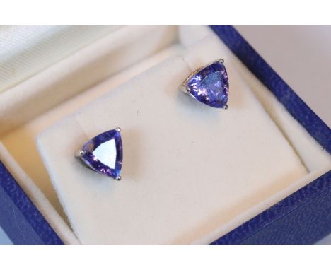 Pair of 18ct white gold and tanzanite stud earrings. Each earring being set with a trilliant cut tanzanite. Estimated 2.12ct 
