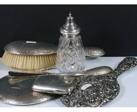 Group of early 20th century silver to include ornate foliate design vanity mirror together with a hammered finish silver mirr