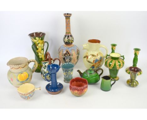 Collection of Torquay and Swiss pottery including Ault, Aller Vale, Watcombe, Honiton, Brannam and Thoune (two shelves)