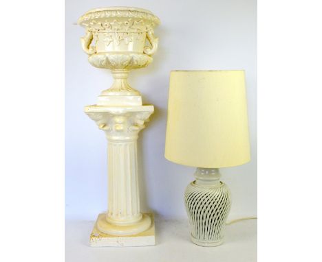 White modern table lamp and a white ceramic urn with classical style pedestal.