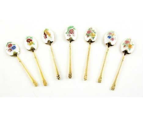 Enamel silver gilt spoons, each painted with a different arrangement of flowers 