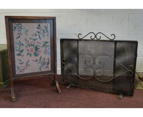 Embroidered fire screen together with a metal fireguard 