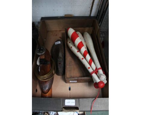 A box containg a bunch of domestic items to include a chocolate box and a table lamp fashioned from a cobblers mould