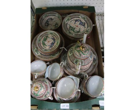A box containing a chinses dragon decorated eggshell porcelain part tea service