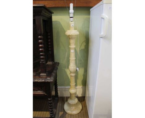 A carved Onyx standard lamp