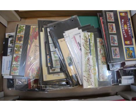 A tray box of First Day Covers, small green album