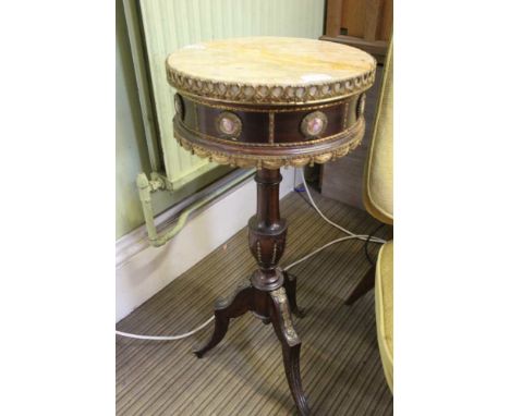 A mahogany occasional or lamp table in the French style, marble top, gilt metal mounted with a frieze of applied porcelain me