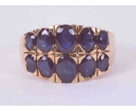 A 9ct yellow gold double row ring set with ten oval cut sapphires, total weight approx. 2.50 carats, 4.72g, size M 1/2.