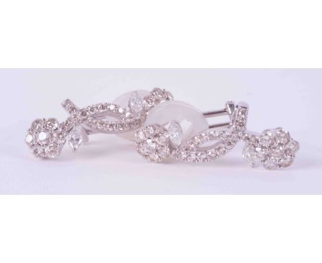 A pair of 18ct white gold double flower earrings set with approx. 3.20 carats total weight of marquise cut &amp; round brilli
