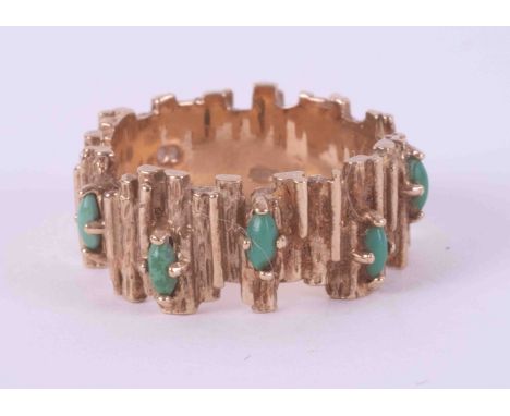 A 9ct yellow gold textured band set with five marquise shaped cabochon cut turquoise stones, 5.79g, size M 1/2 to N.