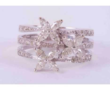 A 14k white gold three row flower design ring set with a mixture of marquise cut and round brilliant cut diamonds, approx. to