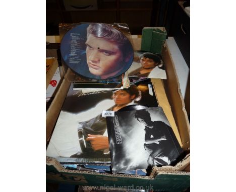 A box of LP's and 45 Rpm to include Michael Jackson, Howard Jones, Tribute to Elvis.