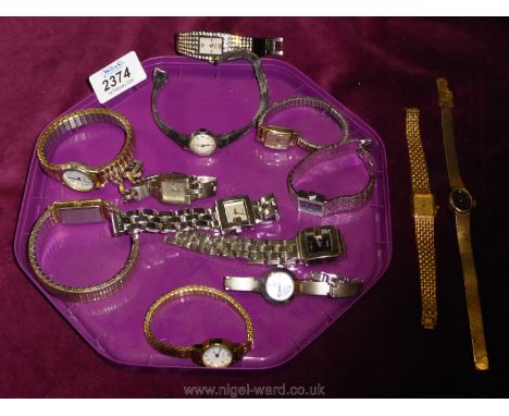 A purple tray of ladies watches including Limit, Rotary, Sekonda etc.
